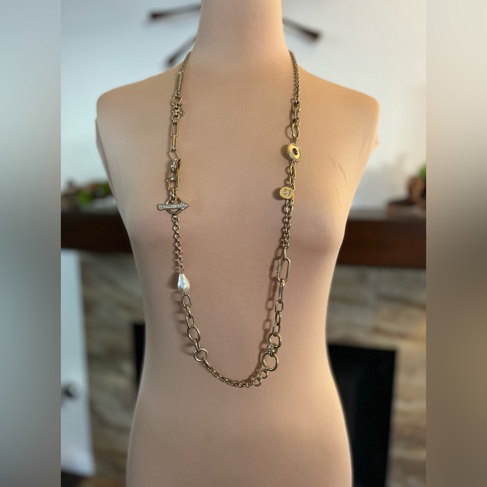 WHBM necklace with mixed metal chains, a faux pearl and charms.